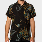 Black Flomotion Button Up with tropical leaf pattern worn by a person on a white background